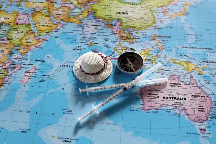 World map featuring a hat compass and injectables for cosmetic tourism